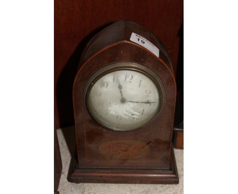 Edwardian inlaid mahogany lancet shaped mantle clock with brass drum movement. 