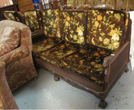 Early 20th century carved mahogany bird and foliate upholstered three piece suite with carved mask head arms on ball and claw