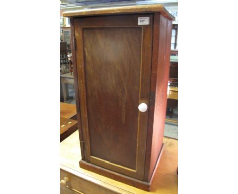Stained pot cupboard on a platform base with ceramic knob handle. 
