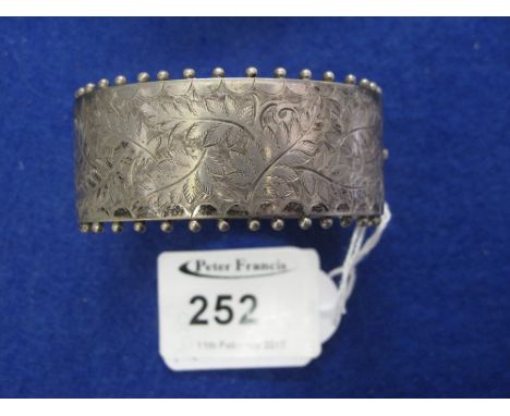 Wide silver engraved bangle. 