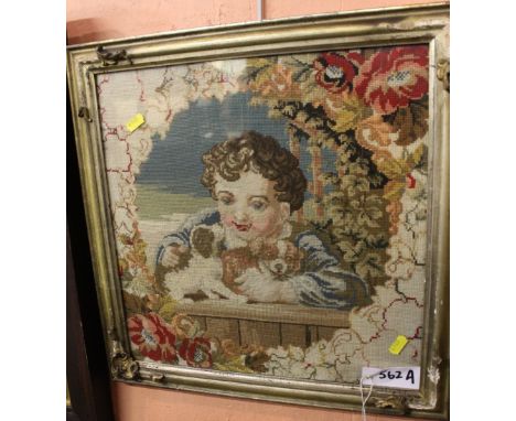 Framed Berlin wool work tapestry study of a little girl with puppies. 