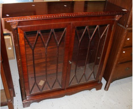 20th century astragal glazed display cabinet with fluted columns on bracket feet. 