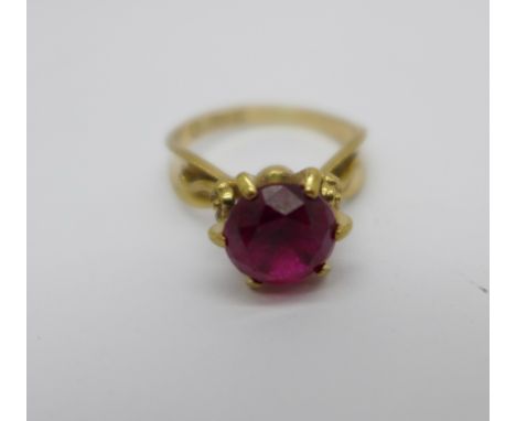 A 9ct gold and red stone ring, 3.1g, M