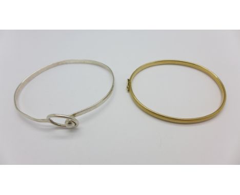 A 9ct gold bangle, 4.5g, and a silver bangle