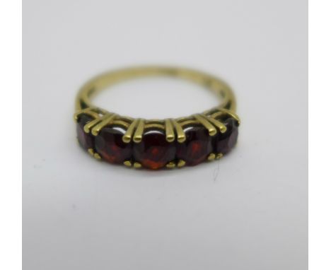 A 9ct gold and five stone garnet ring, 2g, L