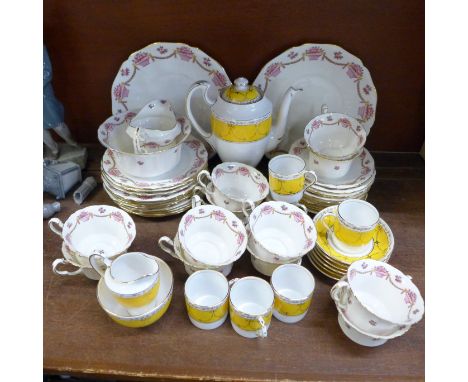 A twelve setting Royal Staffordshire tea service and a six setting coffee service with coffee pot, marked Grosvenor China, J 