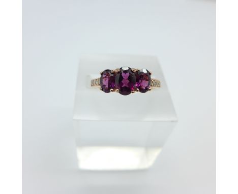 A silver gilt, amethyst and eight diamond ring, Q