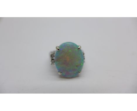 An 18ct white gold, opal and diamond ring, 7.3g, L, opal approximately 18mm x 14mm