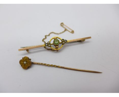 A 9ct gold brooch and a 15ct gold stick pin, 3.2g