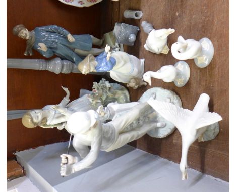 A collection of six Lladro and two Nao figures; (3 Lladro figures a/f, one Nao figure a/f, 3 Lladro birds and one Nao bird)