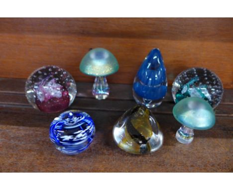Seven glass paperweights including two Caithness