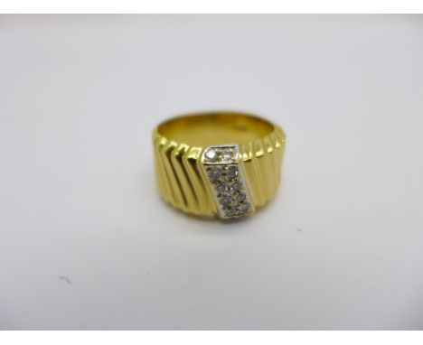 An 18ct gold and twelve stone diamond ring, 9.8g, N