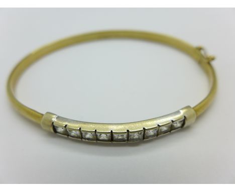 A 9ct gold bangle, marked 9k, 5g