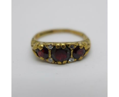 A 9ct gold, garnet and white stone ring, 2.7g, L