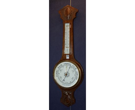 An oak Banjo barometer, with thermometer gauge (crack to glass), 83cm high
