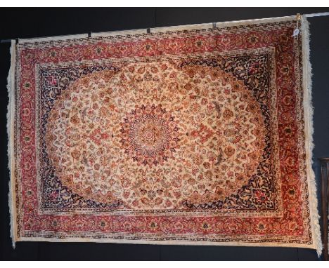 A Kashan carpet, with floral motifs on beige ground, 280 x 200cm