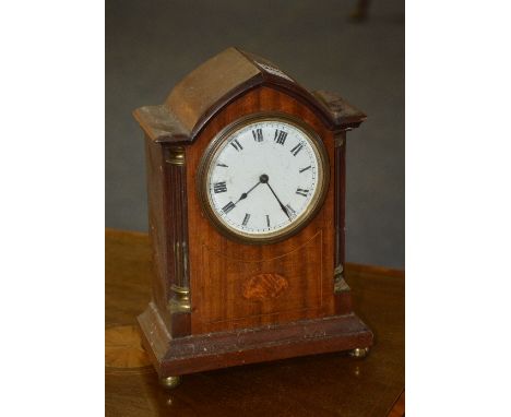 An Edwardian mahogany mantel clock, of lancet form with white enamel dial and Roman numerals, 23cm high