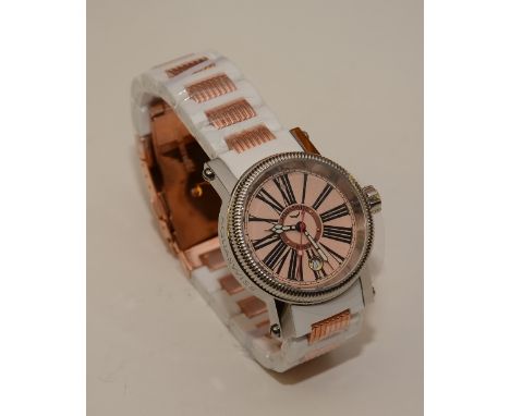An Aquaswiss gents wristwatch, the beige dial with Roman numerals and date aperture, on white plastic and rose steel bracelet