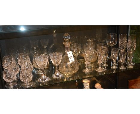A quantity of crystal and glass, to include mallet shape glass decanter, crystal champagne and wine glasses (a lot)