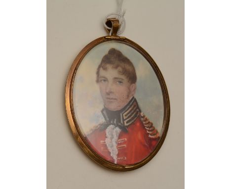 An English portrait miniature circa 1800 of a Dragoon Officer, in red uniform with gold facings and epaulettes, reverse with 