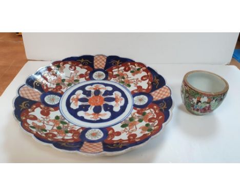 Unmarked Imari Charger (circa 1890) together with an antique hand-painted tea cup (2),The charger measures 30 cm in diameter,