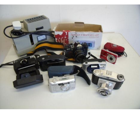 Box of various camera equipment including a Cosina CT7, Baldixette vintage camera, various filters etc 