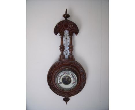 Small carved beech framed aneroid wall barometer with milk glass thermometer plate (overall length 46cm) 