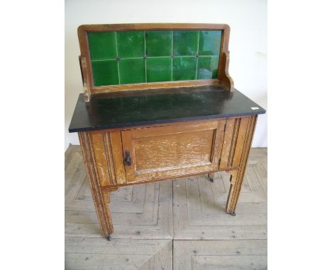 Early 20th C stained beech wash stand with raised tile back and slate top, above single cupboard door (width 92cm) 