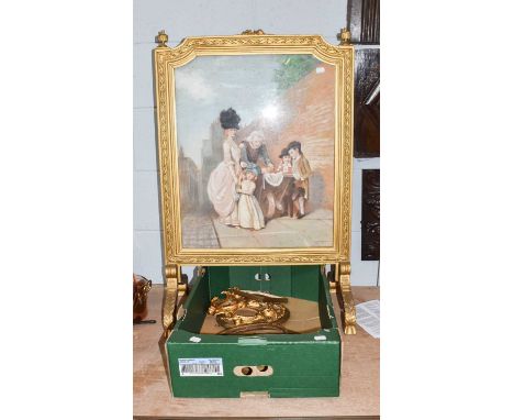 A gilt framed firescreen housing a pastel scene of street vendors, together with various small gilt frames