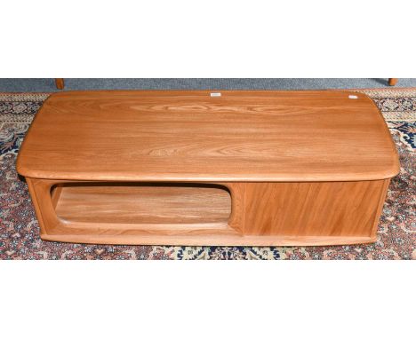 An Ercol light elm coffee table incorporating a pair of drawers, 124cm by 53cm by 39cm