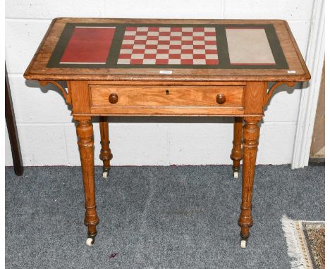 A Victorian light oak games table with leather inset top and single drawer, 89cm by 52cm by 70cm 