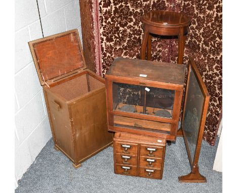 An Edwardian mahogany jardiniere stand, a needlework firescreen and linen basket, an oak filing chest and a set of chemists b