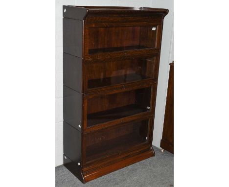 An oak Globe Wernicke style four tier bookcase, 87cm by 36cm by 147cm 