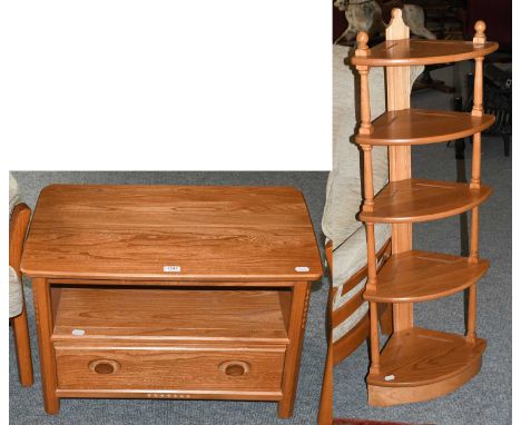 An Ercol light elm single drawer two-tier corner table, with triangular drop leaf, 72cm by 47cm (closed) by 48cm, together wi