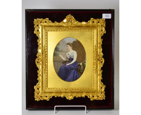* A 19th century English School portrait of a lady sitting on an oak armchair, oil on porcelain, contained within a gilt and 