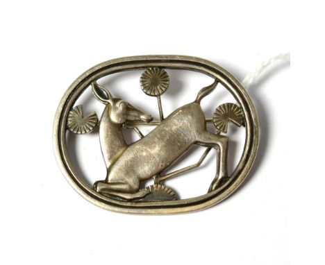 A silver brooch, by Georg Jensen, model no.256, depicting a kneeling deer, measures 4.5cm by 3.6cmGood condition. Hallmarked 