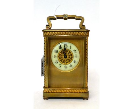 * A brass carriage timepiece, circa 1910, carrying handle, enamel Arabic chapter ring, single barrel movement with a cylinder