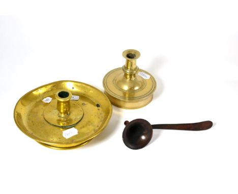 A late 17th century candlestick, 12.5cm; a brass candlestick, 20cm; and a toleware snuffer, 21cm