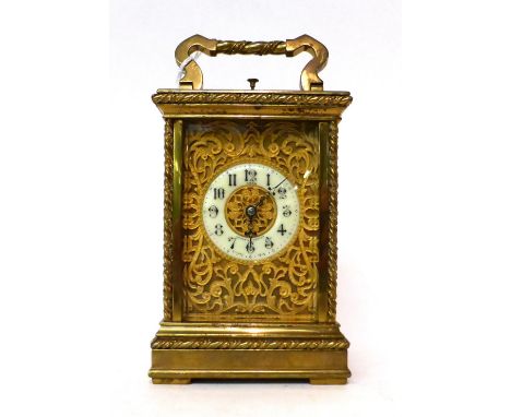 * A brass striking and repeating carriage clock, retailed by Lund, Cornhill, London, circa 1890, carrying handle and repeat b