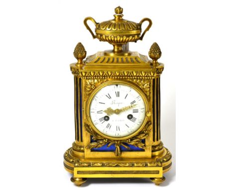 An ormolu striking mantel clock, signed Roque, a Paris, early 19th Century, urn and pineapple finials, 3-1/2-inch dial signed