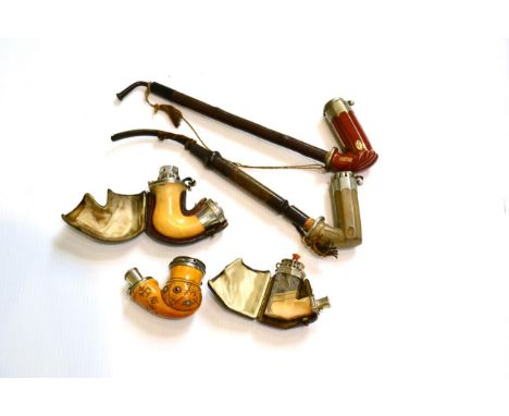 An agate pipe, a meerschaum pipe set with semi precious stone, a Viennese meerschaum pipe with silver mounts and two ceramic 