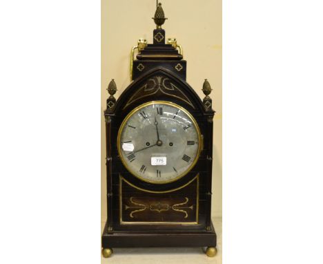 A striking table clock, signed Harrison, Liverpool, circa 1830, the ebony veneered case with an arched caddy pediment, brass 