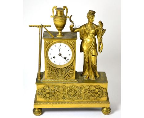 A gilt metal striking mantel clock, S Maurice Cabany, a Paris, circa 1830, case depicting a harvest lady flanked by an urn, a