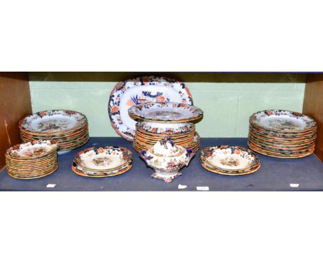 A mid-19th century ironstone dinner service comprising dinner plates, tea-plates, ham dish, platter, one tureen, two tureen s