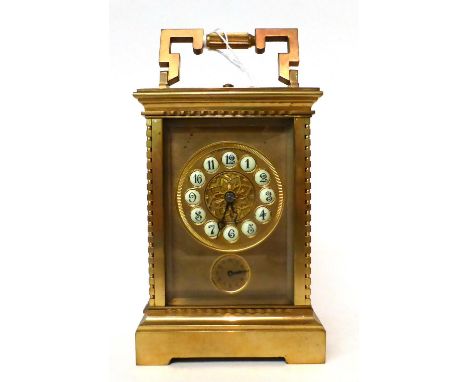 * A brass striking and repeating alarm carriage clock, 20th century, carrying handle, repeat button, enamel cartouches, alarm