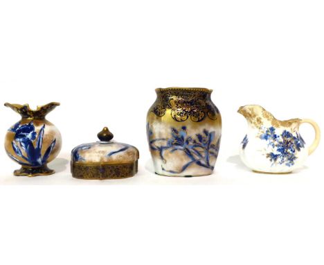 * A Doulton Burslem Flow Blue ovoid vase, 11cm; a similar smaller vase, 9cm; a similar cream jug, 9cm; and a trinket box, 8cm