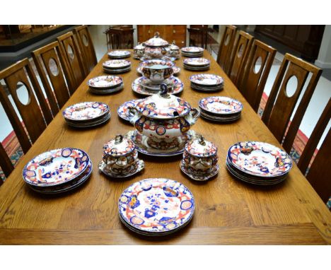 An Ashworth Real Ironstone China Imari dinner service comprising two soup tureens, covers and stand, four sauce tureens, cove