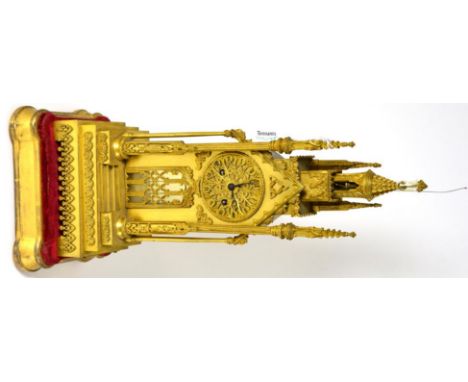 A gilt metal striking Cathedral form mantel clock, circa 1850, surmounted by a concealed bell, Gothic style cathedral form ca