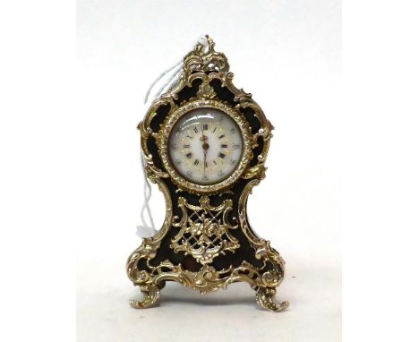 * A miniature tortoiseshell and white metal mounted timepiece, 20th century, white metal scroll mounted case, inside case bac