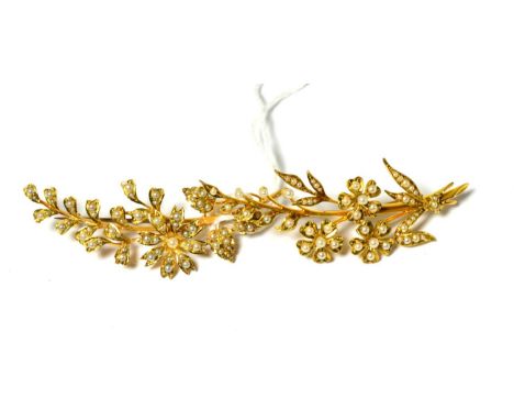 Two Edwardian split pearl floral spray brooches, the first with three floral clusters, length 7cm, the second with one floral